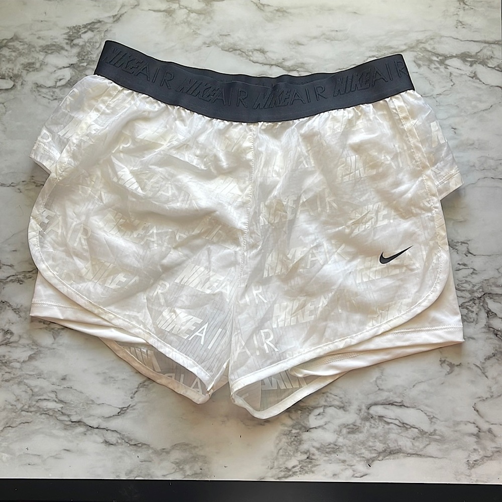 White Nike spandex shorts, black band, and white cover. Nondetachable. Size S